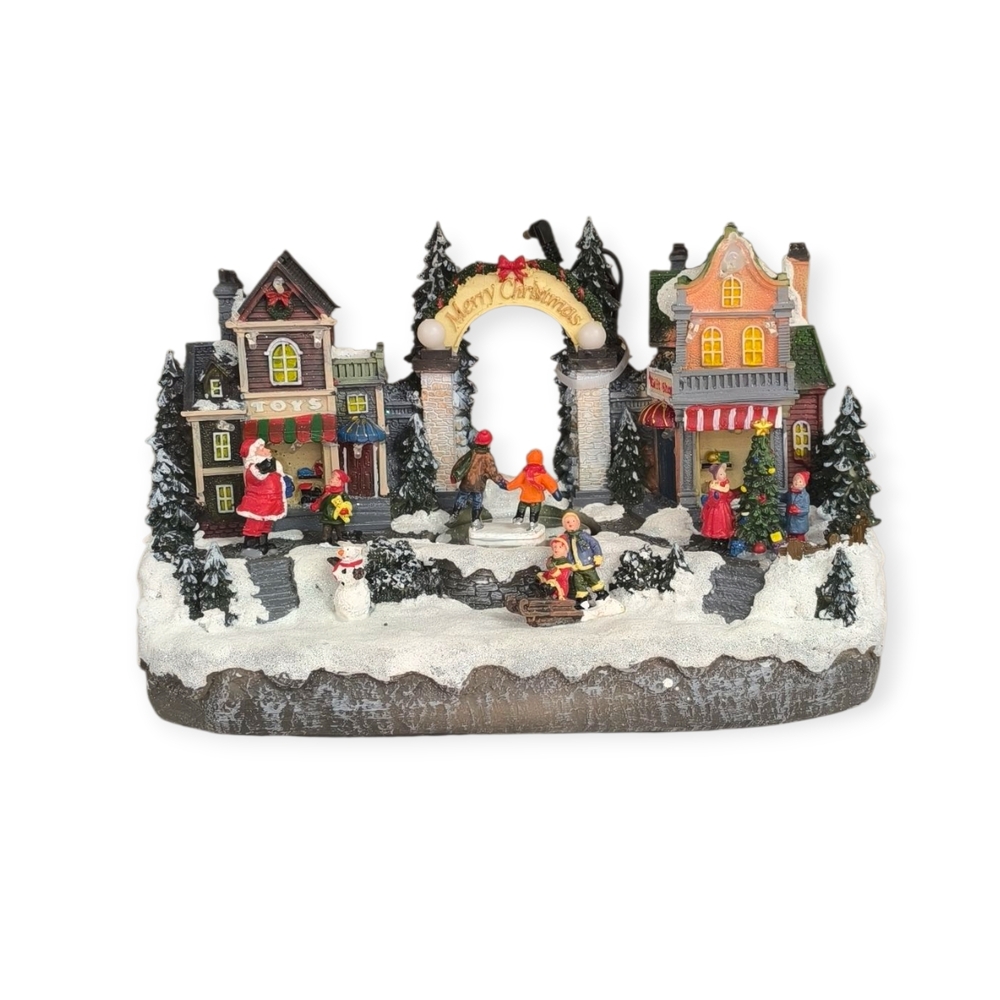 Karácsonyi falu, jelenet boltokkal, gyerekekkel, Mikulással fény és mozgás funkcióval, 33×18×19 cm